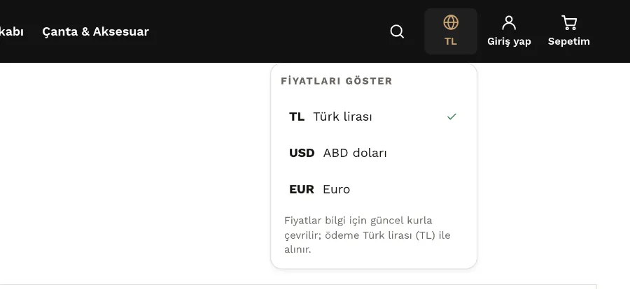 Mağazanın üst alanında açık para birimi seçici: Türk lirası, ABD doları ve euro, altında ödemenin Türk lirasıyla alındığı notu